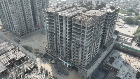 Pan shot of under construction building in Karachi, Pakistan. Aerial. Vídeos de archivo 307942575
