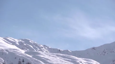 A pan shot of various mountain peaks in the Alps. Stock Footage 286345469