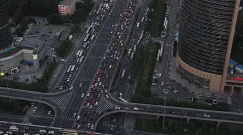 Pan shot Vehicles driving through a bridge during the evening rush hour Stock Footage 41458871