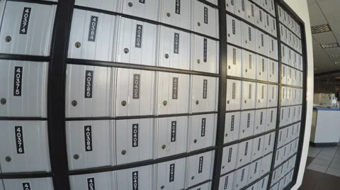 Pan Shot Of A Wall Of Post Office Lock Boxes - Downey CA Vidéo 65236625