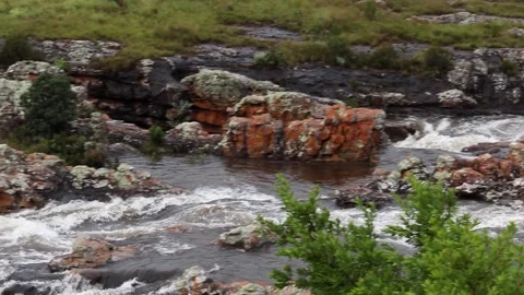 Pan shot of water rushing towards the Lisbon Falls. Filmed right after a Stock Footage 147406764