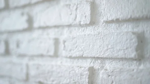 Pan shot of white brick wall for transition background, slow motion Stock Footage 121433693