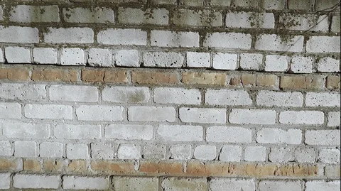Pan shot of white brick wall for transition background, slow motion Stock Footage 124992256