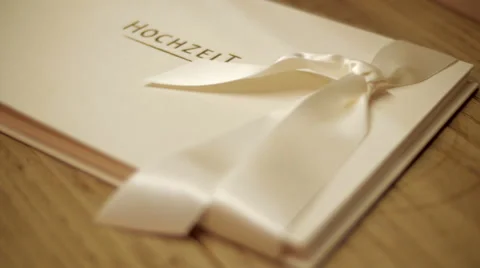 Pan shot on a white wedding memory booklet Video stock 56149877