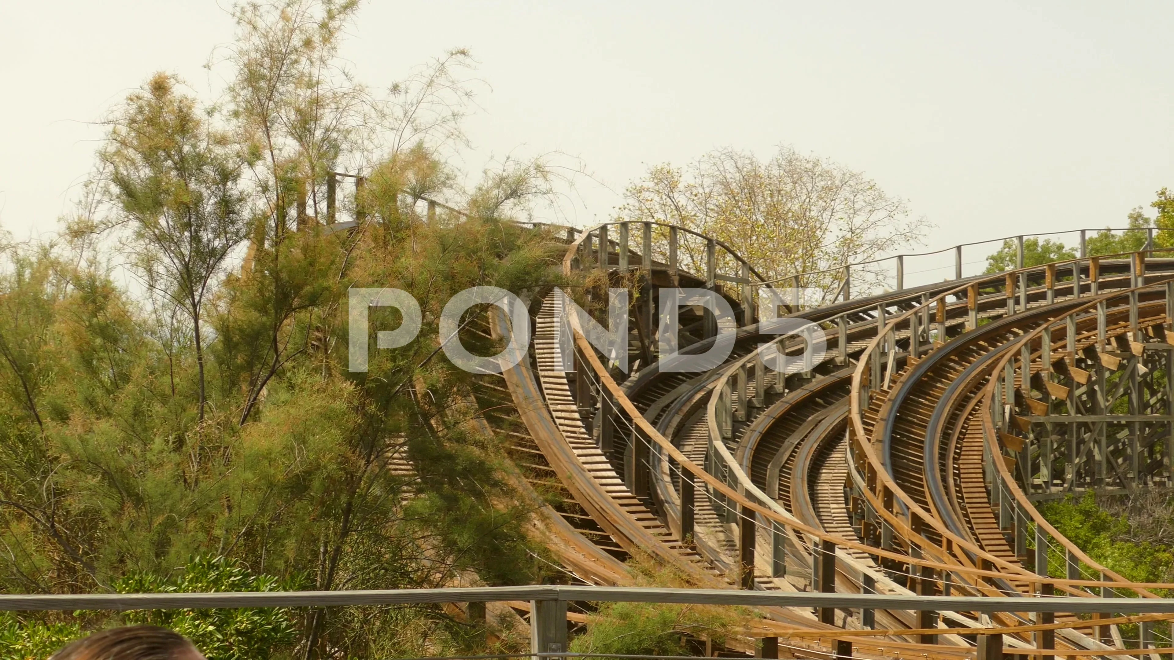 Pan shot of the wooden Stampida roller coaster in Port Aventura Park