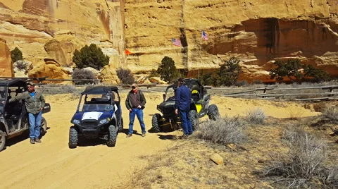 Pan-Side by side recreation vehicles and ATV in desert Stock Footage 61488665