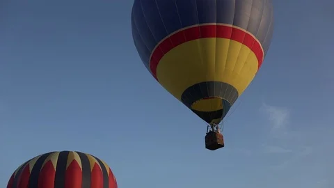 Pan single hot air balloon - clear sky with puffy clouds Stock Footage 77734343