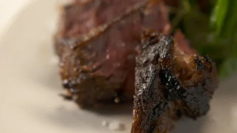 Pan up of sliced steak  Stock Footage 112660475