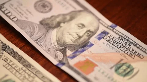Pan slow hundred dollar bills new and old Stock Footage 75763605