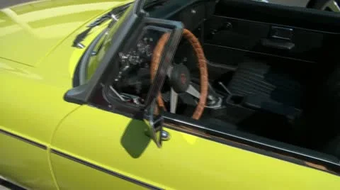 Pan of Small Classic Car Convertible Видео 12600452