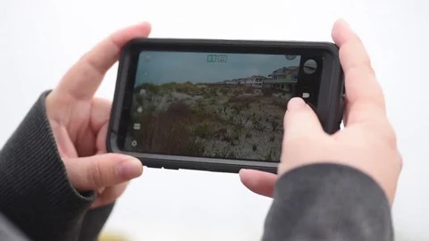 Pan to smart phone in camera mode Stock Footage 75770353