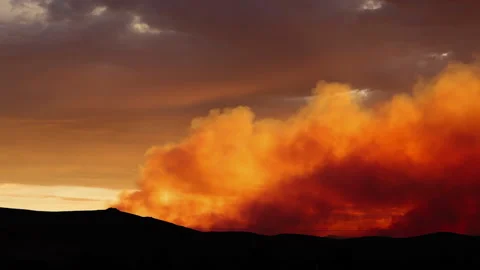 Pan of Smoke from Wild Fire at Sunset Stock Footage 137686895