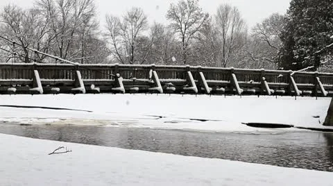 Pan of Snow Covered Rustic Foot Bridge Stock-Footage 10842323