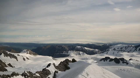 Pan of snowy mountain peaks Video stock 55539314