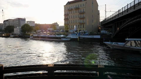 Pan of Spree river with tour sightseeing boat passing under bridge. Stock-Footage 116240217