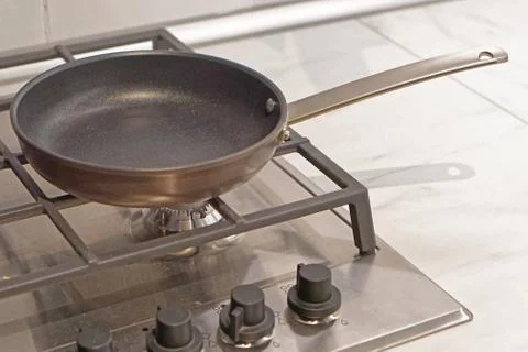 Pan at stove Stock Photos