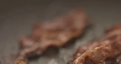 Pan with strips of fried bacon on stove Stock Footage 81068244