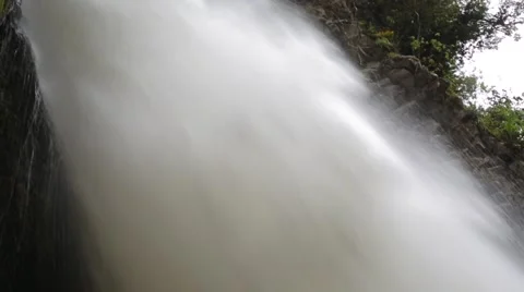 Pan up to strong beautiful waterfall Stock Footage 41870289