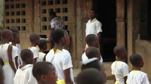 PAN: STUDENTS SINGING AT MORNING ASSEMBLY AT SCHOOL Stock Footage 60517584