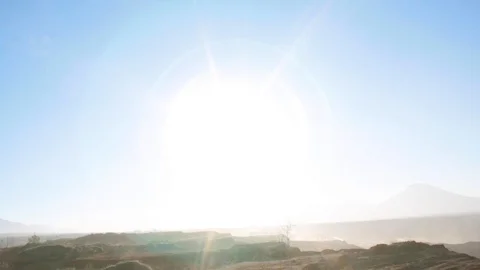 Pan from sun to a general view of the moon-like coal min in southern Greece Stock-Footage 121402525