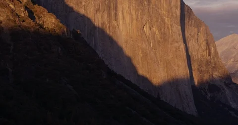 Pan of Sun setting over El Capitan, Yosemite National Park, Califorina, Shot Video stock 103449997