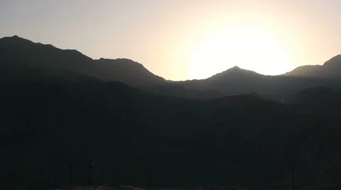Pan on sunset over Snowdonia mountain range Stock Footage 33846428