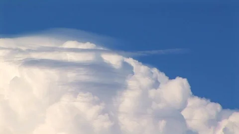 Pan up through dense white clouds to blue sky in Needles, California USA Stock Footage 103290089
