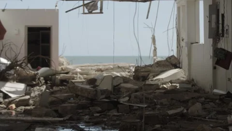 Pan up through rubble in aftermath of hurricane Melissa Stock Footage 340820775