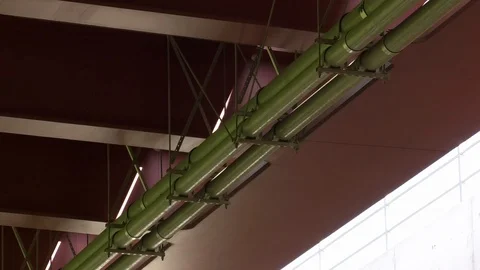 Pan, Tilt: Details from the underside of an extradosed highway bridge, pipes Stock Footage 89436166