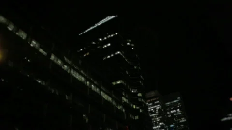 Pan / tilt from skyscraper to near empty streets Stock Footage 712952
