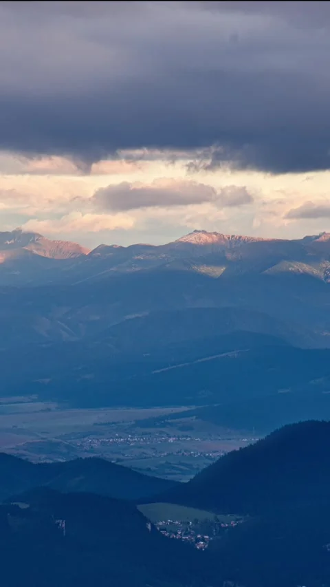 Pan time-lapse shot of alpine mountains with fast-moving clouds, mountain Stock Footage 293778167
