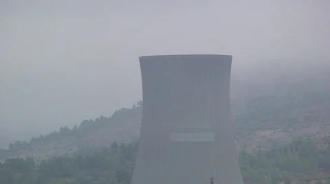 Pan from the top to a nuclear cooling tower to the next, pan right Stock Footage 49928705