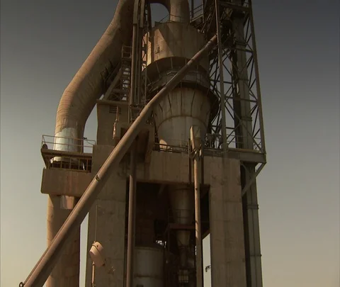 Pan from top of tower to high angle view of Vikram Cement works. Stock Footage 86742894