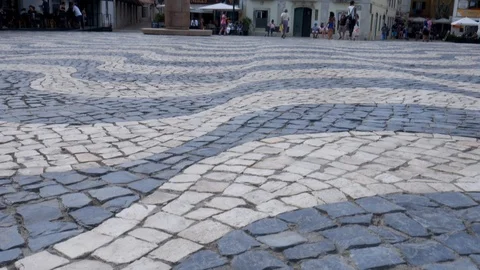 Pan up of tourists at Central square 5th October in Cascais with statue of Dom Stock Footage 112294260