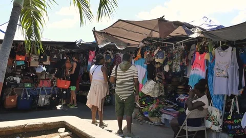Pan-Tourists stroll through outdoor bazaar Charlotte Amalie St Thoma Stock Footage 73433154