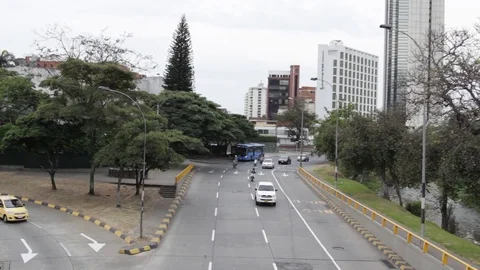 Pan up of traffic moving forward away from Cali Tower in Cali Stock-Footage 122307915