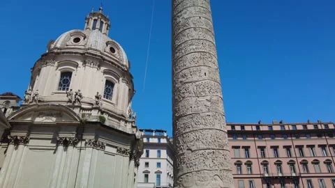 Pan up of Trajans column, one of the major monuments found in the Roman Forum Stock Footage 153977442