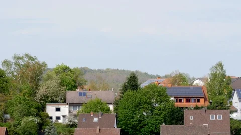 Pan: Trees in between privates homes in small rural village Otterbach in spring 库存影片 128781084