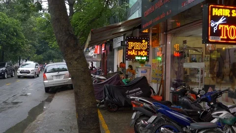 Pan of trendy shops in district 2 after rain Stock-Footage 97258617