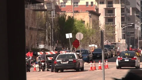 Pan to Trinity and San Jacinto Street with crowds in Austin Texas during SXSW Stock Footage 82912270
