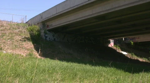 Pan under a concrete overpass Stock Footage 661310