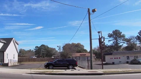 Pan of an urban scene gas stations car wash and homes in Georgia Stock Footage 181809448