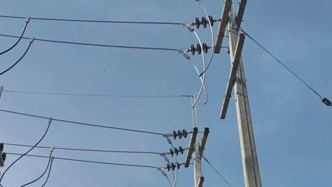 Pan up video of bare aluminum cables preparing for connection. Stock Footage 340376837