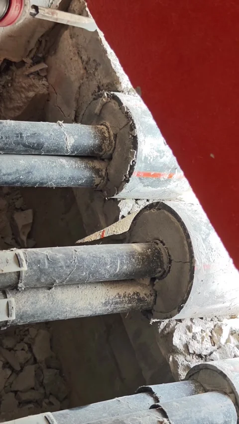 Pan up video of heavy electrical cables coiled on large wooden drums, indus.. Stock Footage 345201726
