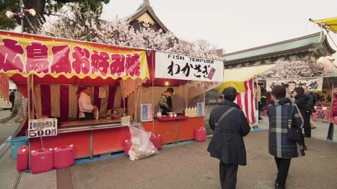 Pan video of a statue of ox worn in Yushima Tenmagu shrine. Stock-Footage 128211535