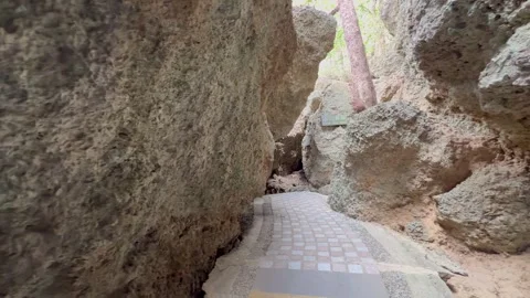 Pan view of beautiful limestone cave entrance Stock Footage 269130763