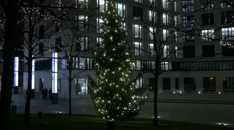 Pan view of a Christmas tree and modern buildings on Christmas in Frankfurt Stock Footage 60663457