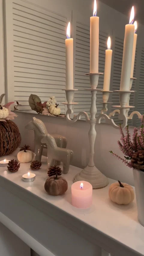 Pan View Cozy Autumn Decor on Wooden Fireplace Candlelight 9:16 Stock Footage 344763809