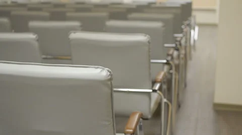 Pan view of empty conference hall with comfortable seats. Video stock 65986792