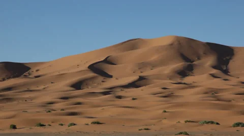 Pan view of Erg Chebbi dunes; Erg Chebbi desert, Morocco, Africa. Stock Footage 34446724